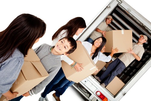Removal team loading household belongings for a Docklands home move
