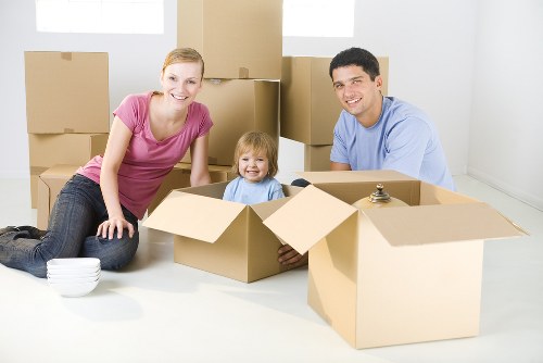 Student removals team handling boxes in a Docklands apartment block