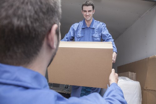 Local removals van positioned for a Docklands apartment building with access challenges