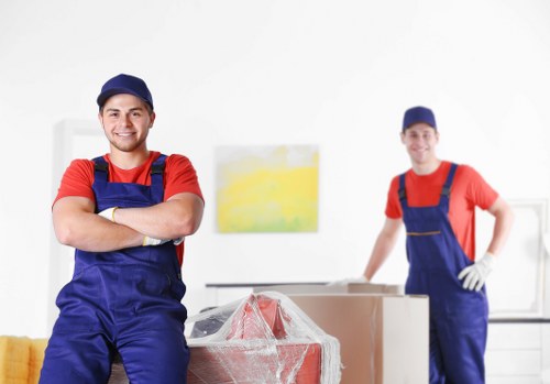Removalists loading household furniture in Docklands near apartment access
