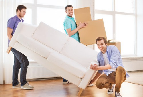 Local team removing bulky furniture from a Docklands property